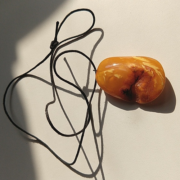 Genuine Baltic egg yolk amber pendant charm on cord necklace